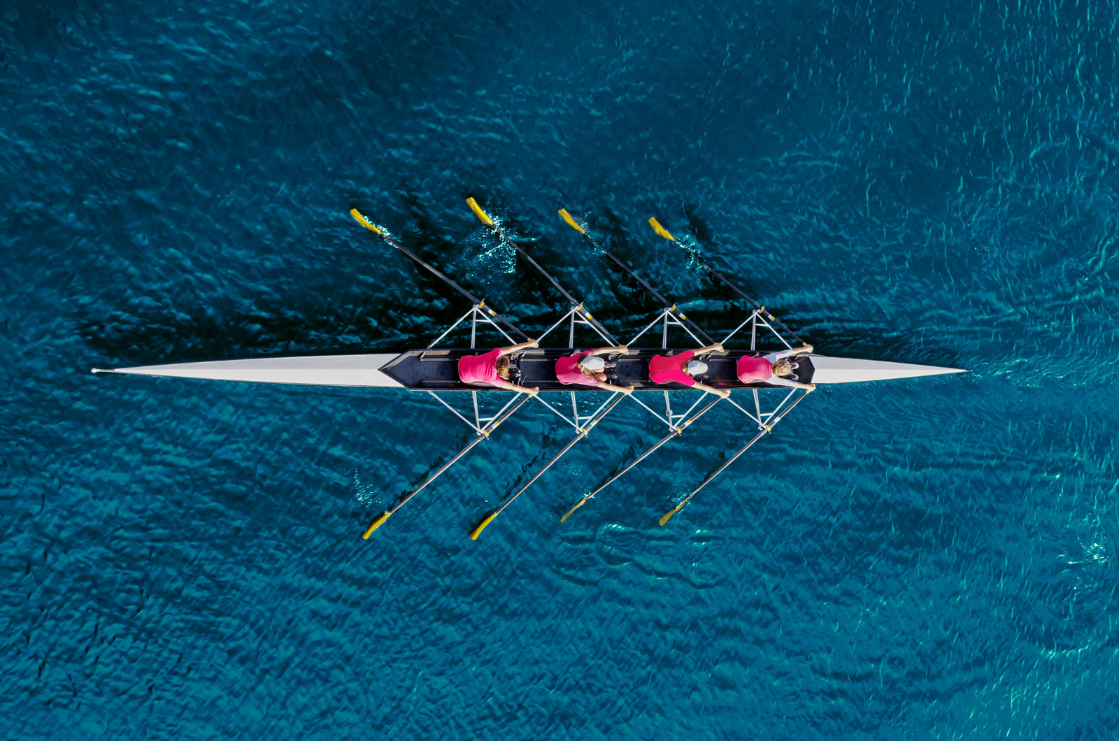 people rowing on a row boat on a clear body of water - Investing for Income